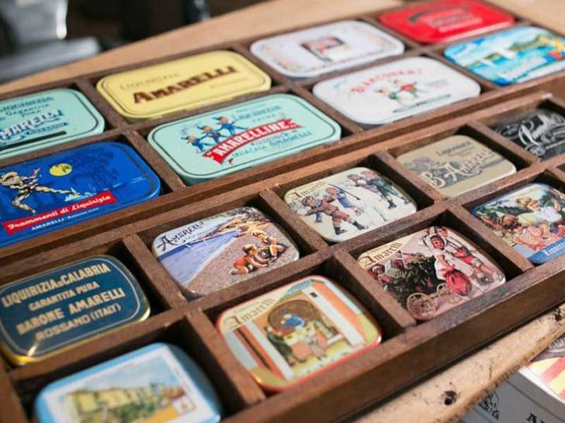 Display case with historic tins of Amarelli liquorice